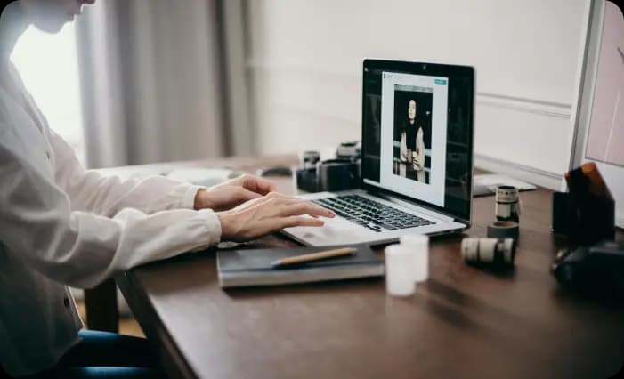 Person typing on laptop browsing sustainable products for Swag Pack